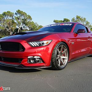 Project 6gr wheels on a Ruby Red Ford Mustang GT Front Side View