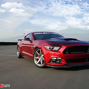 Project 6gr wheels on a Ruby Red Ford Mustang GT Front Side 3 View