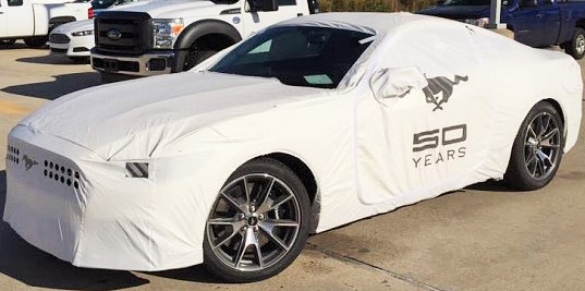Karma wrapped in transport cover @ dealership, after unloading from hauler