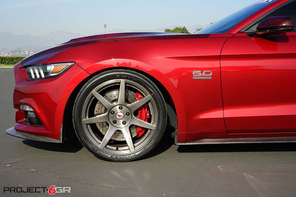 Project 6gr wheels on a Ruby Red Ford Mustang GT Front Side close up View